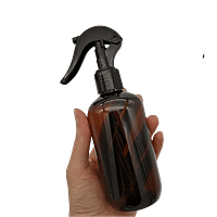 250ml Amber PET bottle with trigger spray in hand